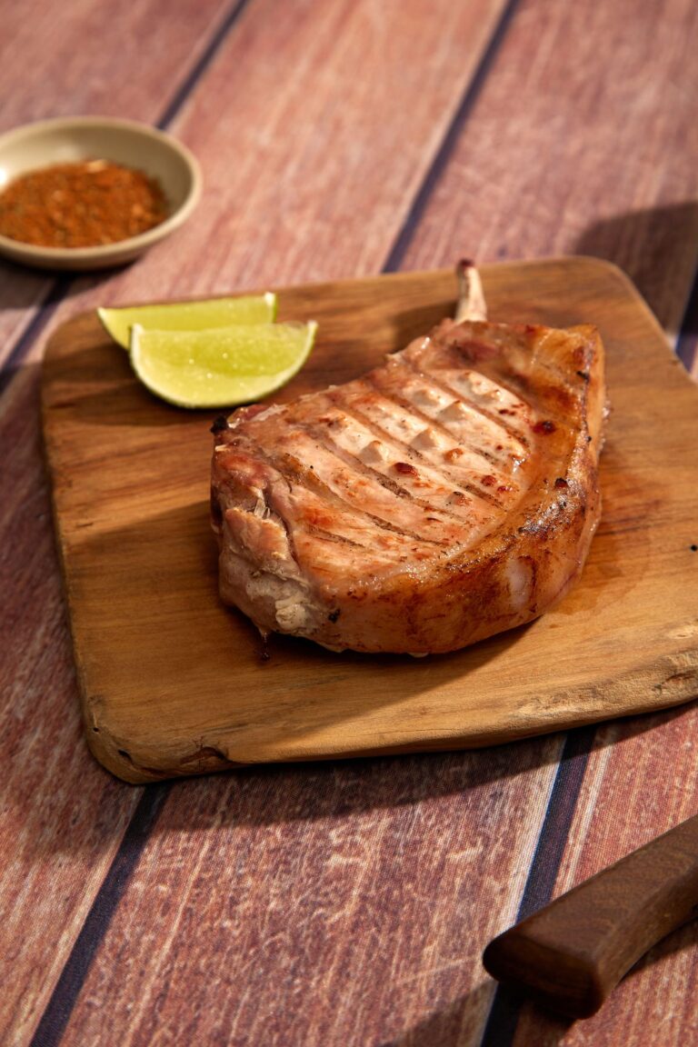 Pork chop on a wooden board