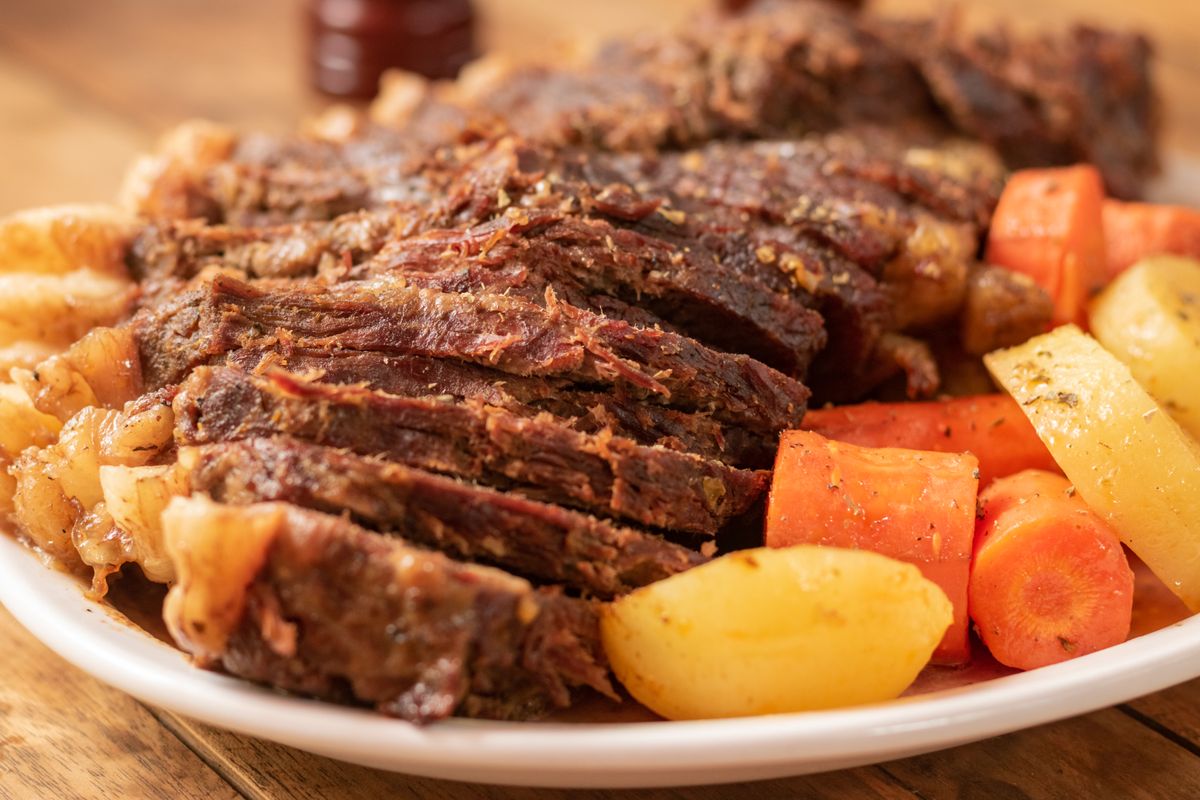 Porcini and red wine beef pot roast with carrots and potatoes on a plate