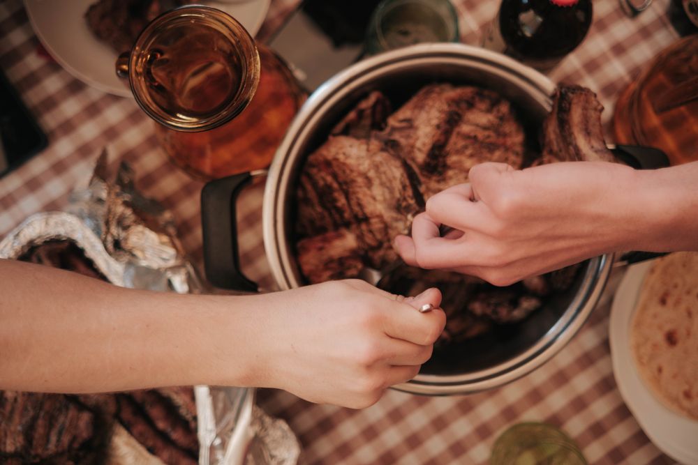Pot roast served family style straight from the pot at the dinner table