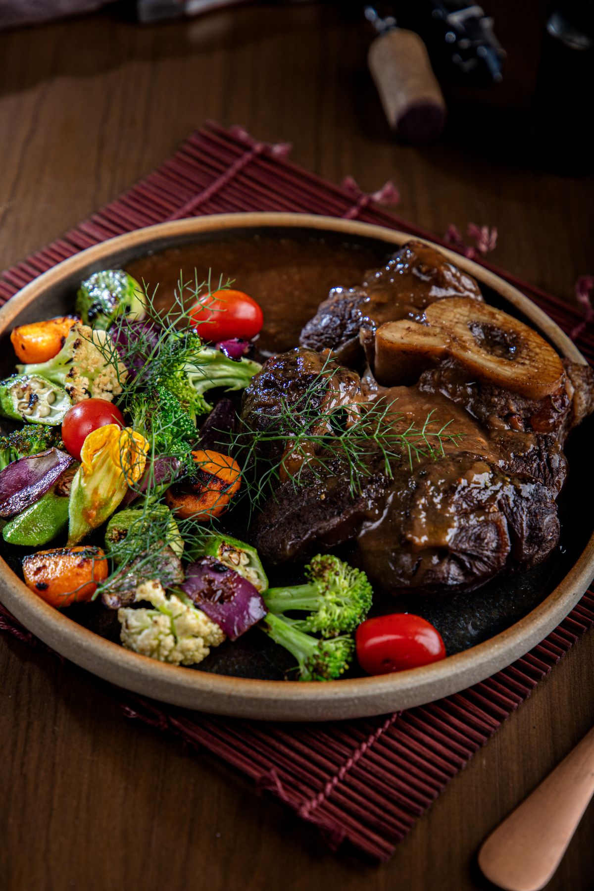 Braised veal osso buco with vegetables on a plate