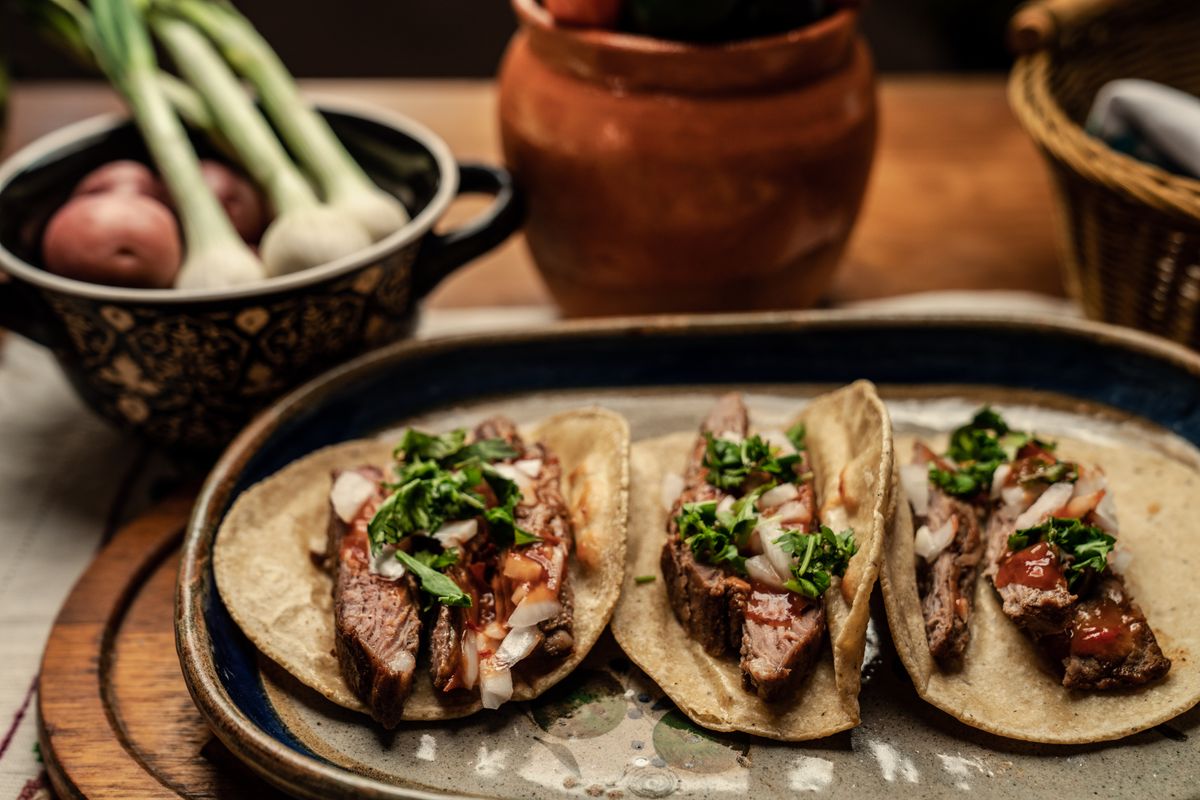 Steak tacos with cilantro and onion