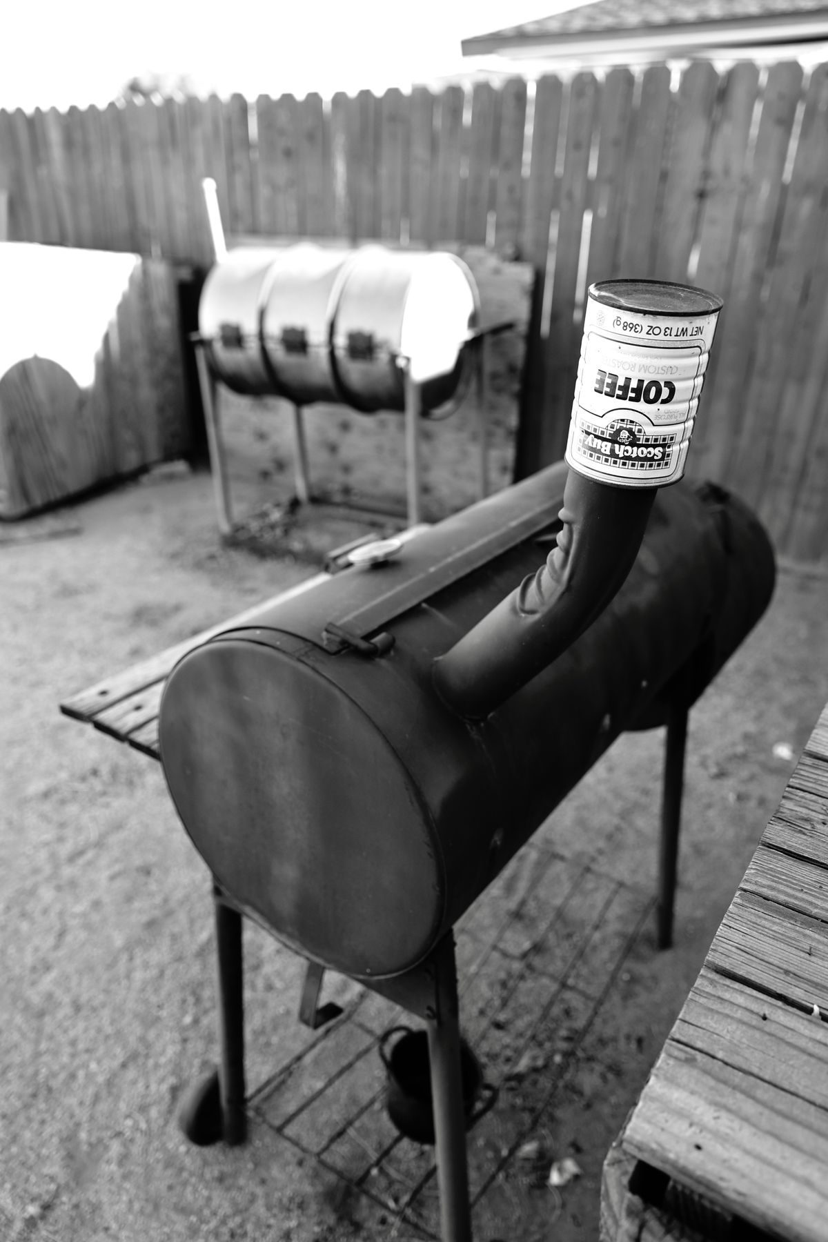 A backyard offset smoker running low and slow