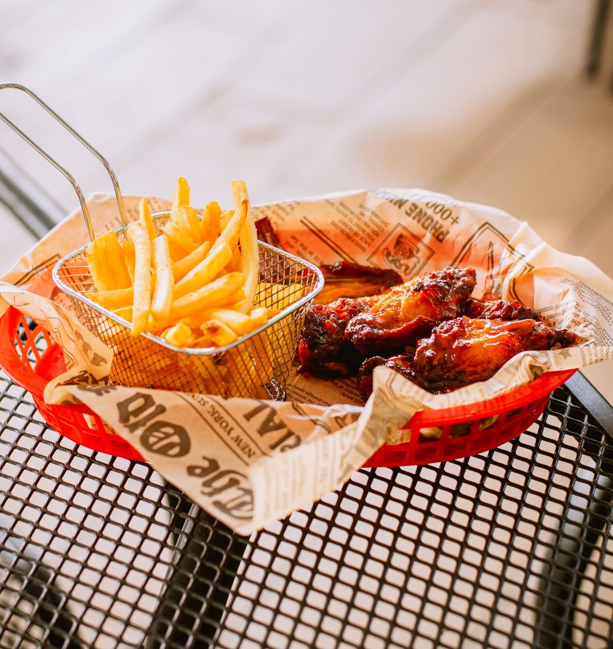 Chicken wings baked crisp on a rack before saucing