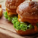 Bison burger with melted cheese, house pickles, and special sauce on a toasted bun