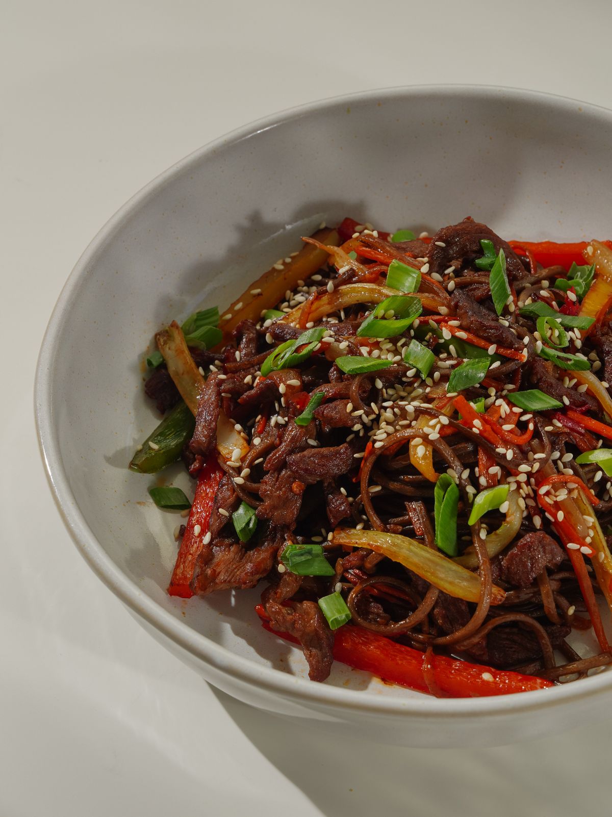 Hanger steak bulgogi with vegetables and toasted sesame seeds