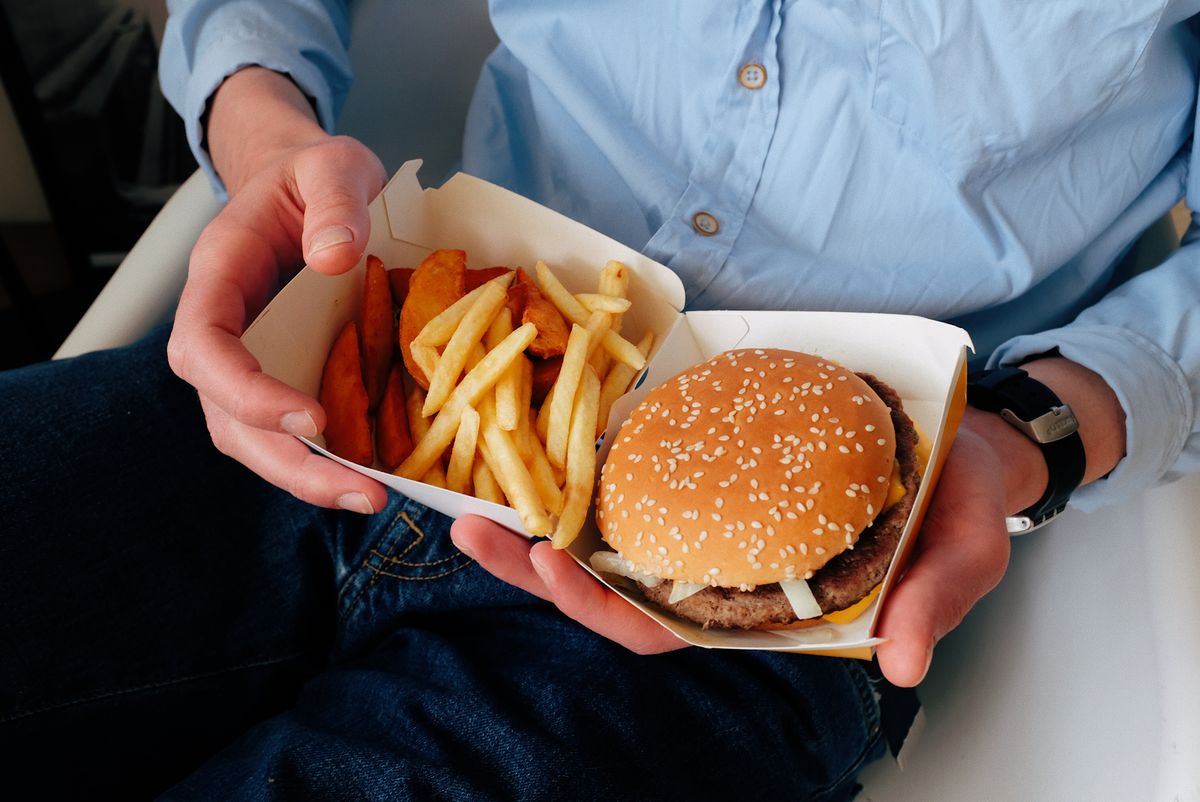 A juicy cheeseburger with a seared crust on a soft bun