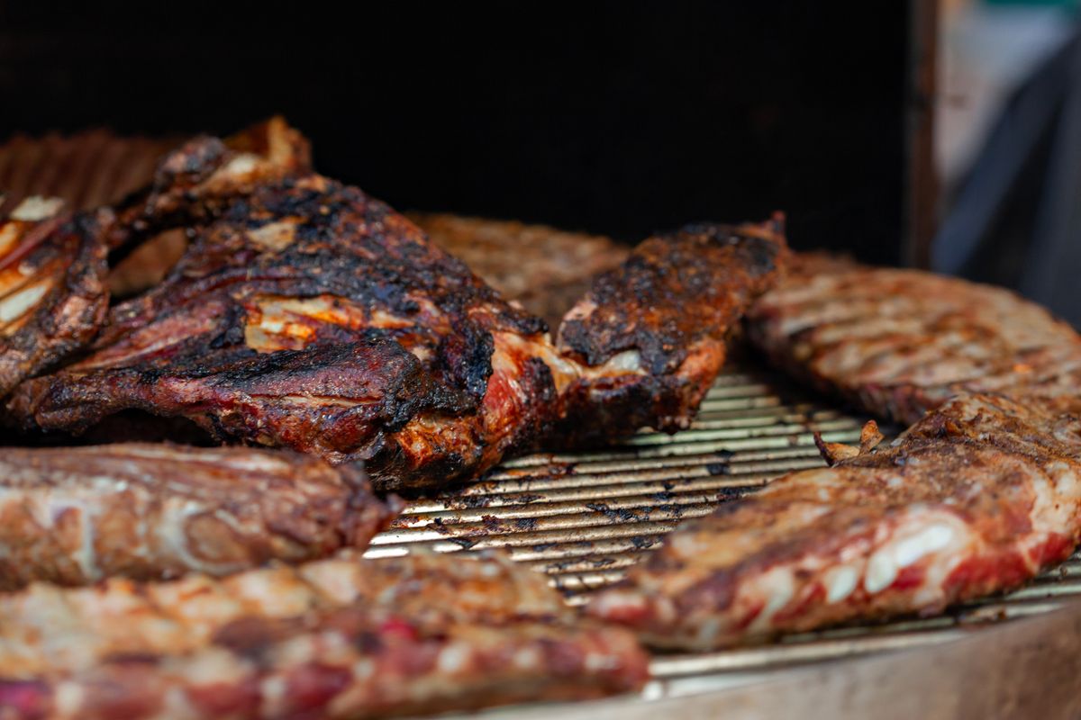 Meat searing in a hot cast iron pan for a browned crust