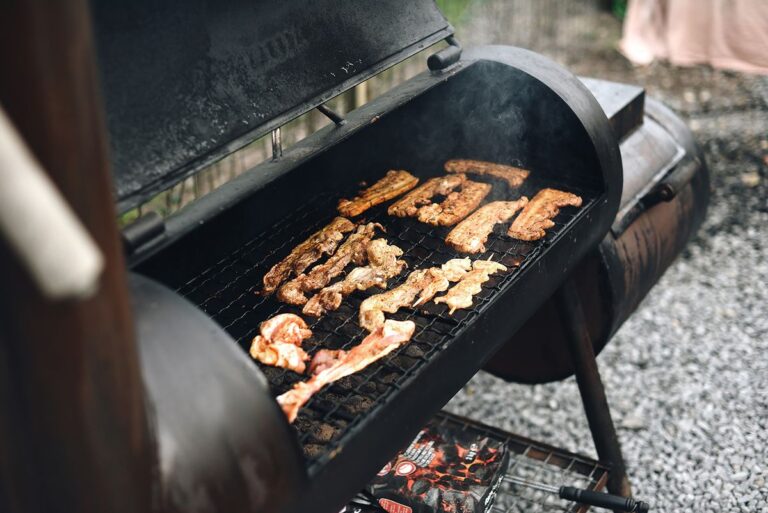 Meat smoking low and slow in a backyard smoker