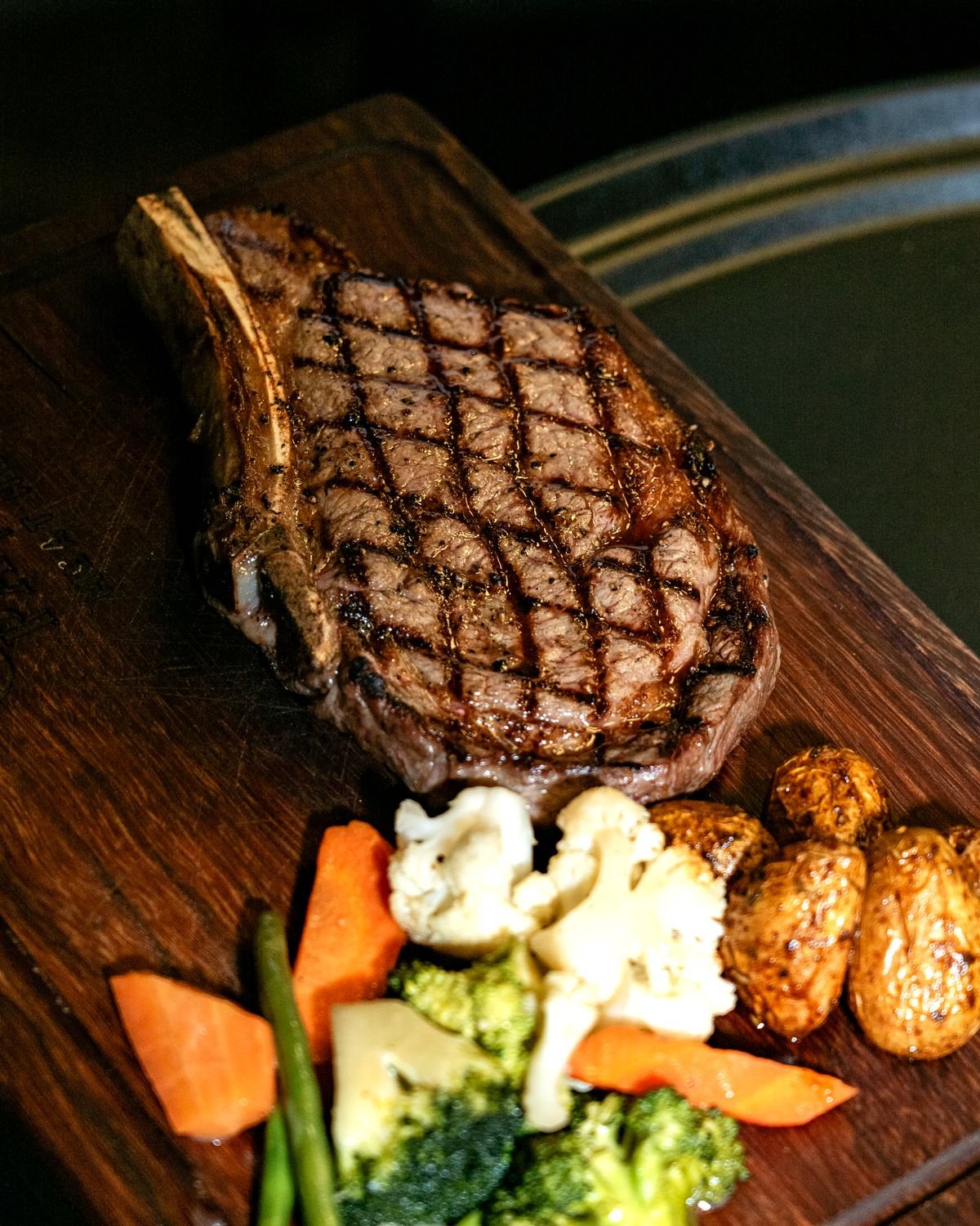 Sous vide ribeye seared and plated with roasted vegetables