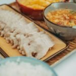 Sliced char siu pork with lacquered edges served over rice with pickled daikon