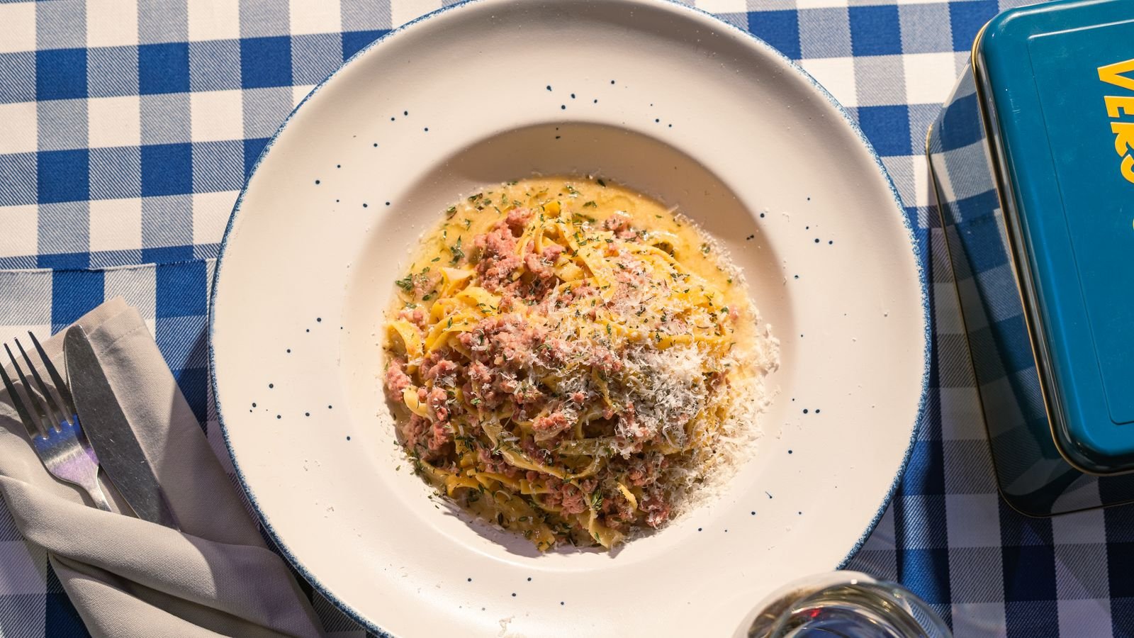 Creamy pasta finished in the pan and served with grated cheese