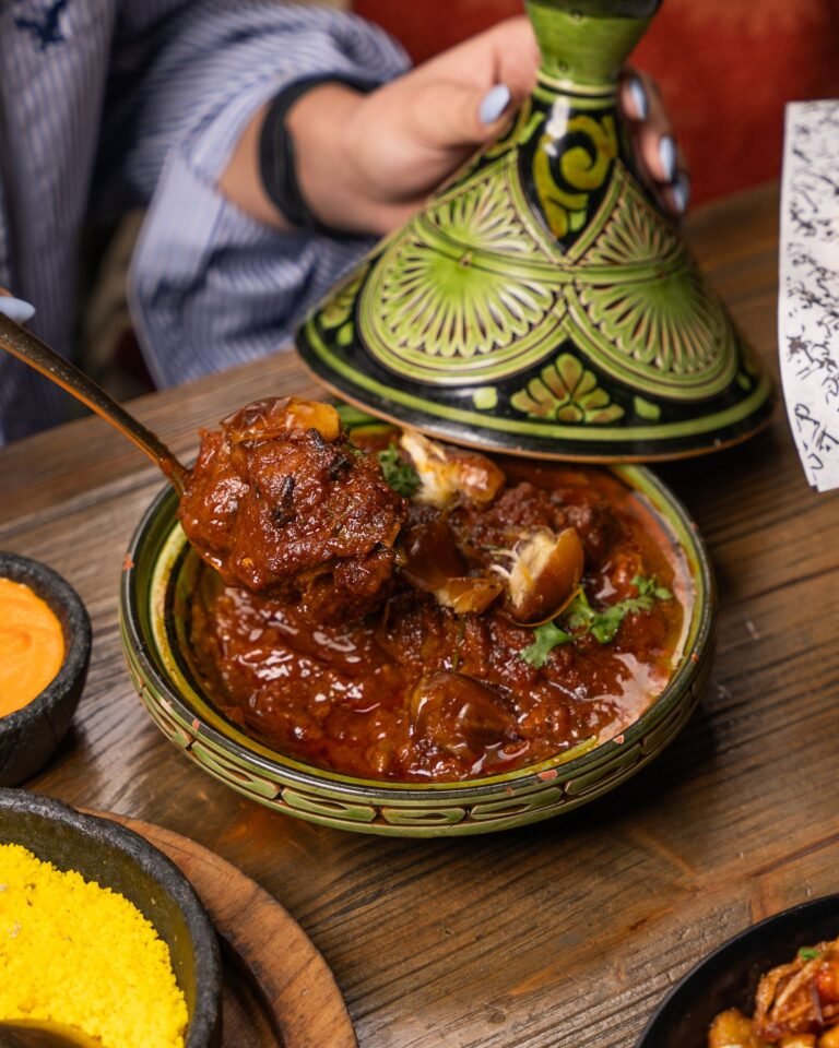 Moroccan lamb tagine with tender shoulder in a traditional conical pot