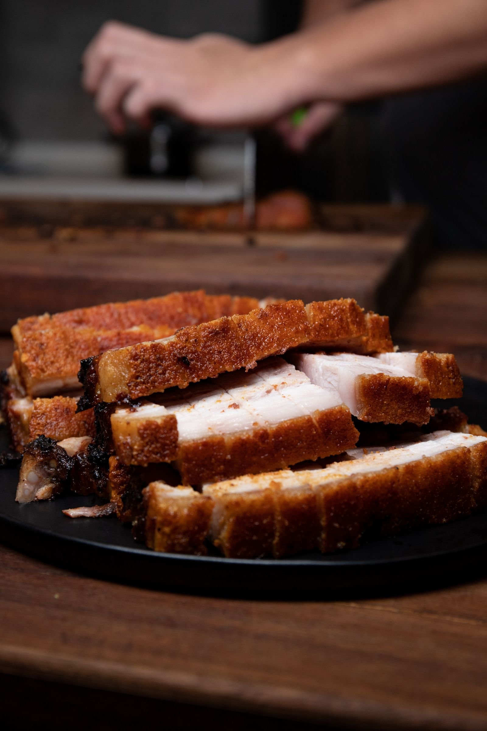 Slices of roast pork belly with crackling skin